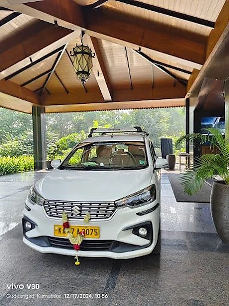 Ganavi Tours & Travels MPV parked for a pickup in Gokarna, Karnataka