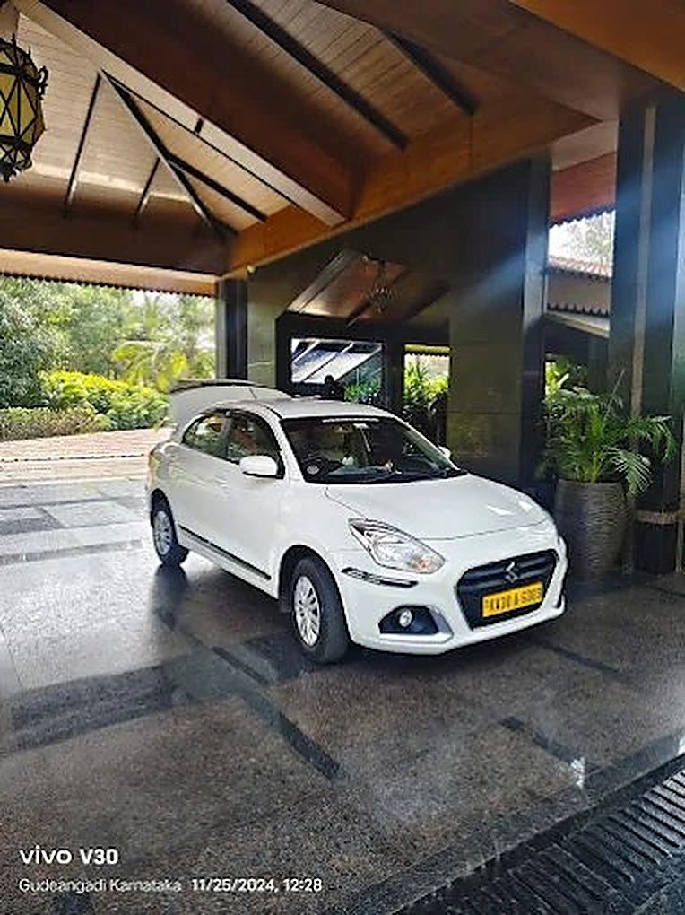 Ganavi Tours & Travels sedan parked for a pickup in Gokarna, Karnataka